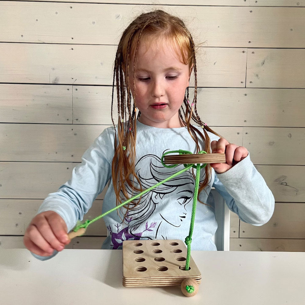 Montessori veramā poga ar rāmi