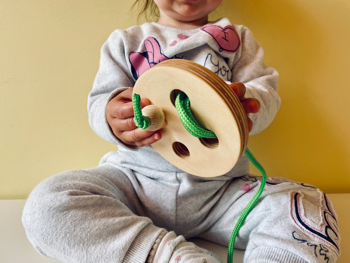 Montessori veramā poga ar rāmi